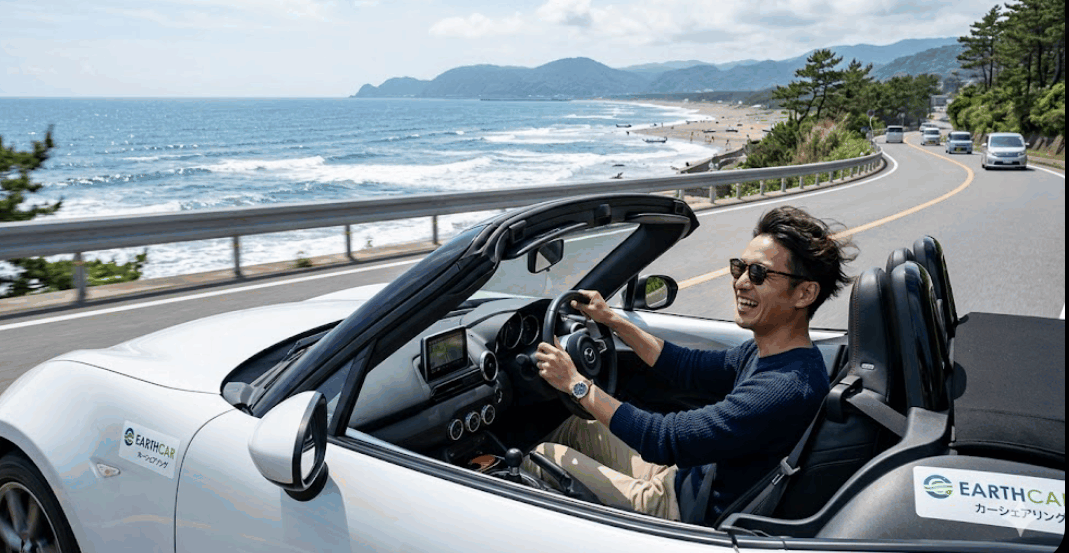 アースカー(EARTHCAR)で憧れのオープンカーをレンタルし、海辺をドライブする30代男性